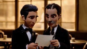 Animated Carlos Gardel and another man read a document together in a warmly lit room.